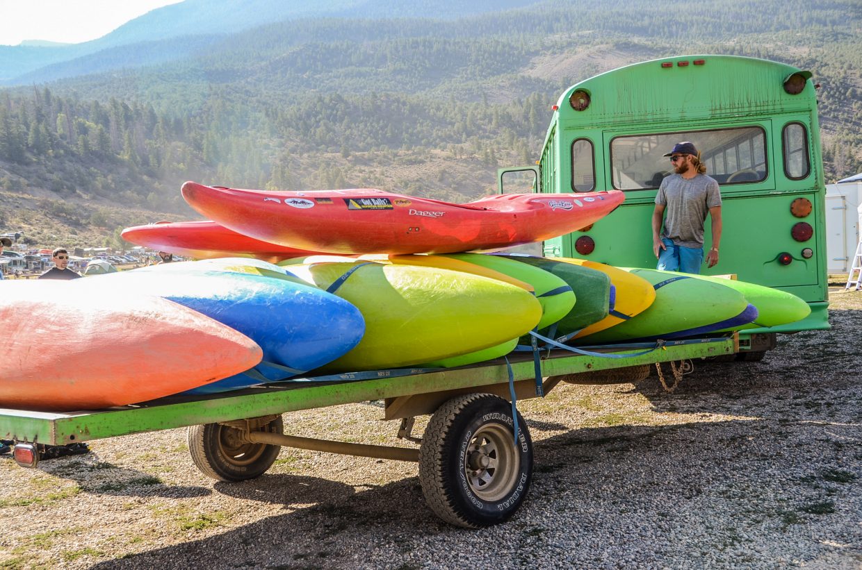 A colorful collection of kayaks sit on a trailer not far from the Colorado River during Gorefest.