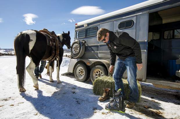 Vinny Pestello of Breckenridge prepares to don his ski boots to practice skijoring at Pass Creek Ranch near Ute Pass north of Silverthorne on Wednesday, Feb. 27.