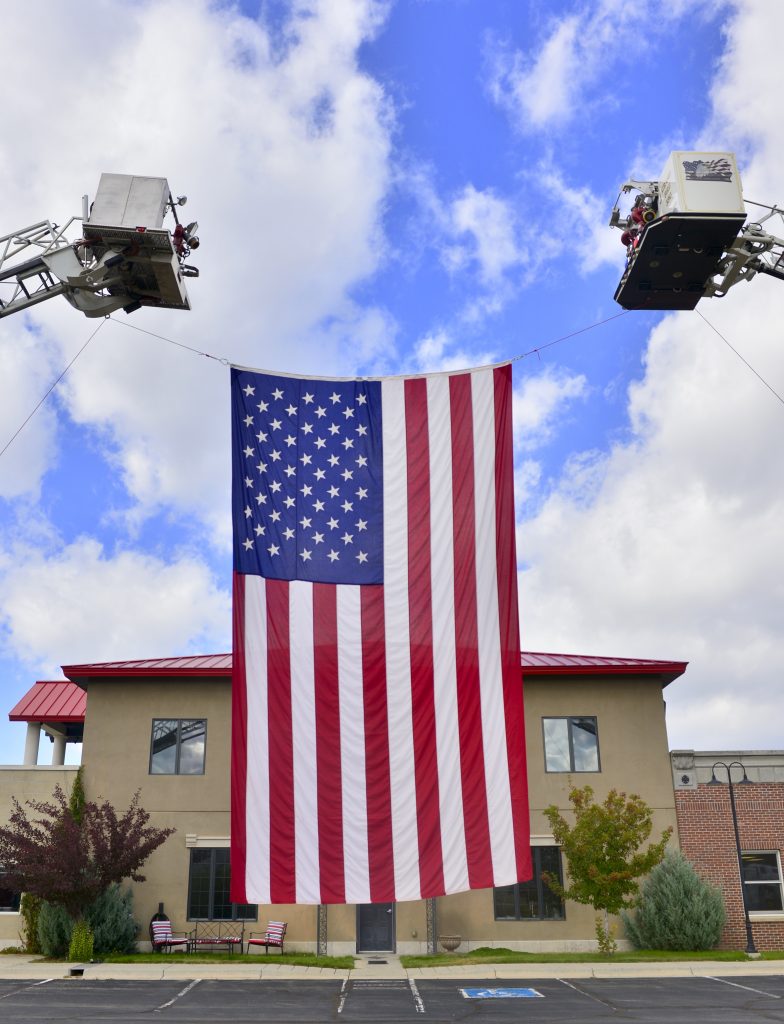 An American flag flies in front of the Grand Fire Protection District on Wednesday.