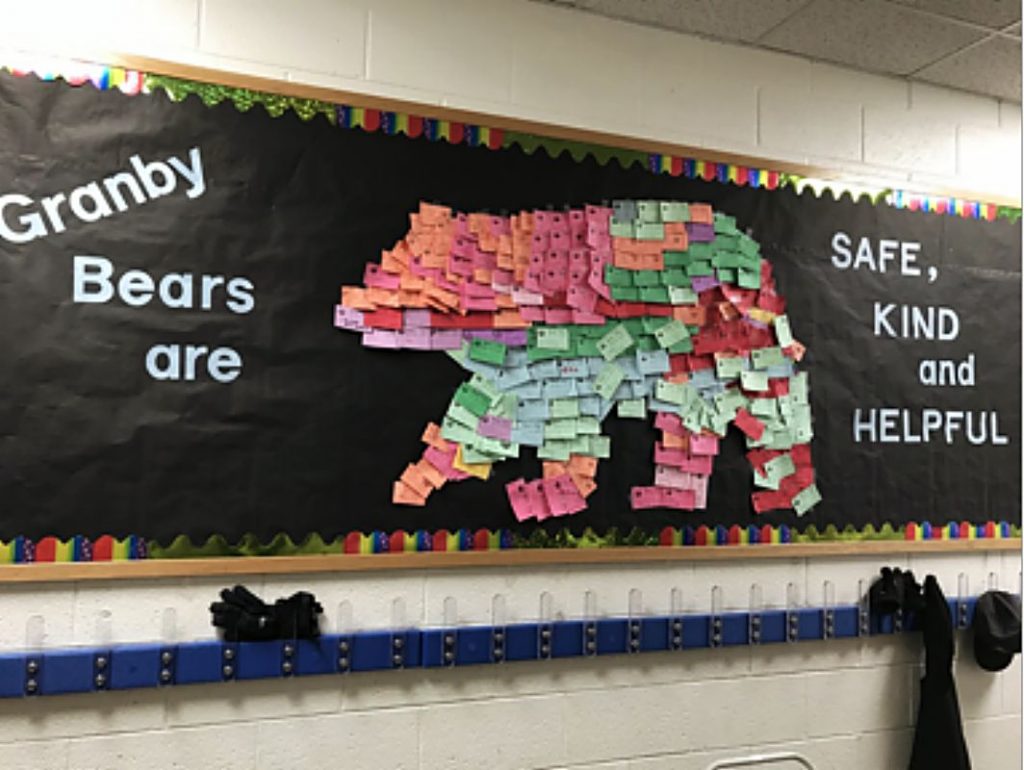 The entire Granby Bear on the bulletin board at Granby Elementary is made out of notes given to students for positive behavior.