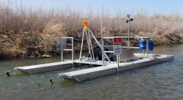 Crews from the U.S. Fish and Wildlife Service operate a screw trap on the Truckee River.