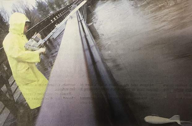 Kip Allander, a hydrologist with the U.S. Geological Survey, take sediment samples Wednesday, Jan. 1, 1997, on the Upper Truckee River after measuring the flow. The Lake Tahoe tributary crested the banks and flooded the meadows in the area.