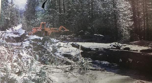California Department of Transportation road crews near Strawberry work on clearing U.S. 50 of mud, rocks and trees in early January 1997.