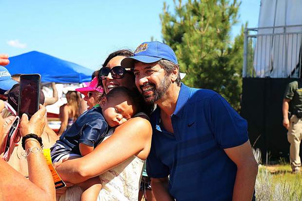 Everybody loves him: Comedian Ray Romano poses with a mother and her child on July 14, 2018, at Edgewood Golf Course.